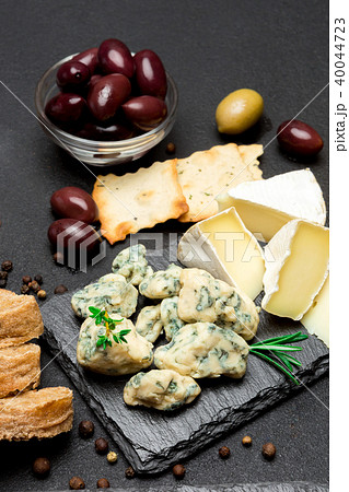 Slice of French Roquefort cheese on stone board 40044723