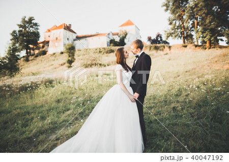 Sensual married couple, valentines hugging in front of old slavic castle 40047192