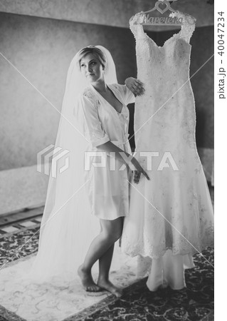 Portrait of beautiful bride with fashion veil at wedding morning Portrait of beautiful bride with fashion veil at wedding morning 40047234