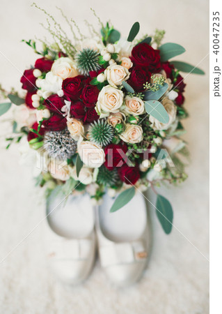 Beautiful wedding bouquet with different flowers, roses Beautiful wedding bouquet with different flowers, roses 40047235