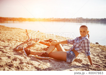 woman on a bicycle in beach 40047863