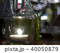 Close-up of table in a restaurant with a candle 40050879
