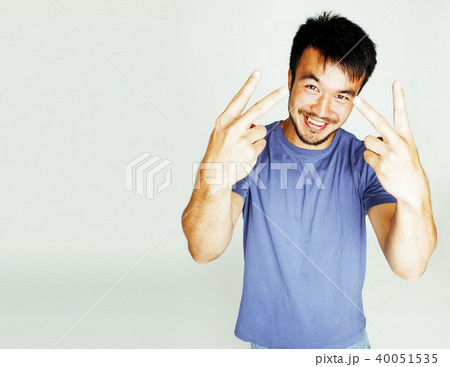 young cute asian man on white background gesturing emotional, po 40051535