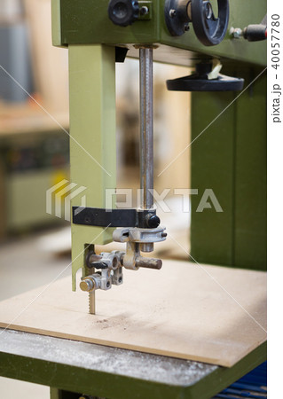 jig saw machine sawing board at workshop 40057780