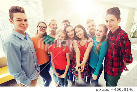 group of students taking selfie with smartphone 40058146