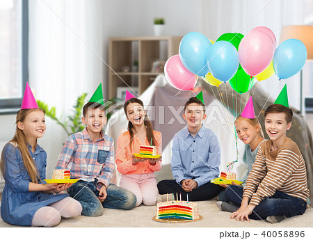 happy children in party hats with birthday cake 40058896