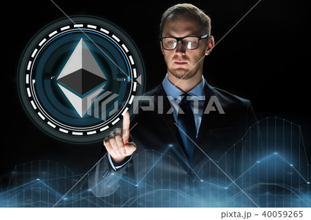 businessman hand with ethereum hologram over black 40059265