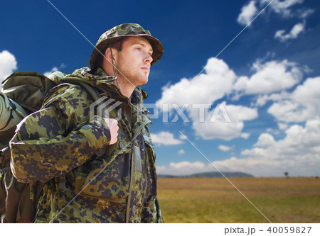 soldier in military uniform with backpack hiking 40059827
