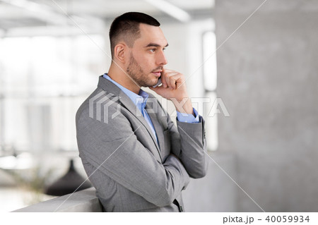 businessman calling on smartphone at office businessman calling on smartphone at office 40059934
