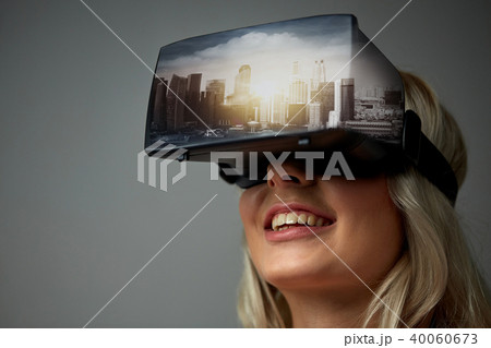woman in virtual reality headset or 3d glasses 40060673