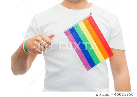 man with gay pride rainbow flag and wristband 40061250