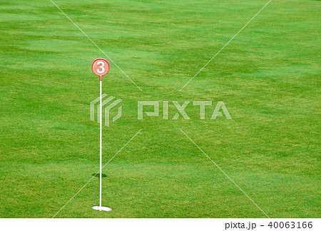 Golf putting green and marked with a red sign Golf putting green and marked with a red sign 40063166
