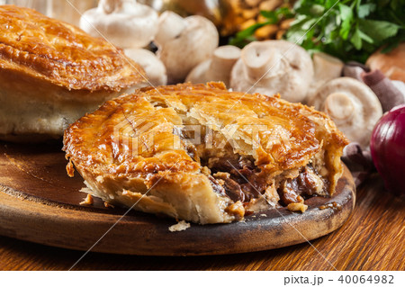 Fresh beef stew pie on a cutting board 40064982