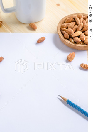 Almond snack on wooden table 40067207