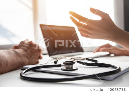 Female Doctor talking with senior man patient. Female Doctor talking with senior man patient. 40073758