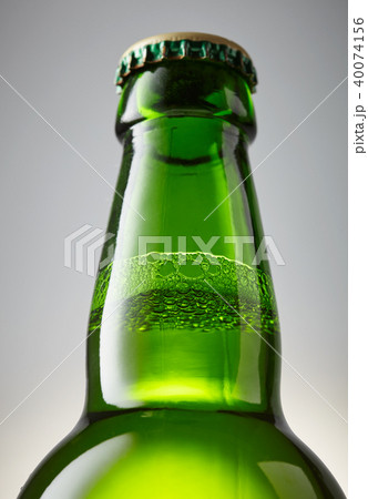 Green bottle of beer close-up Green bottle of beer close-up 40074156