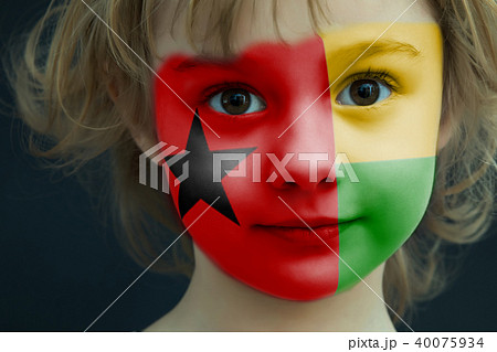 Child with a painted flag of Guinea Bissau Child with a painted flag of Guinea Bissau 40075934