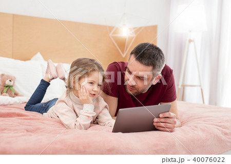 Happy girl having fun with her father 40076022