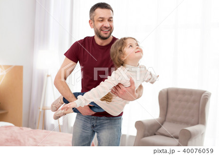 Cheerful father having fun with his daughter 40076059