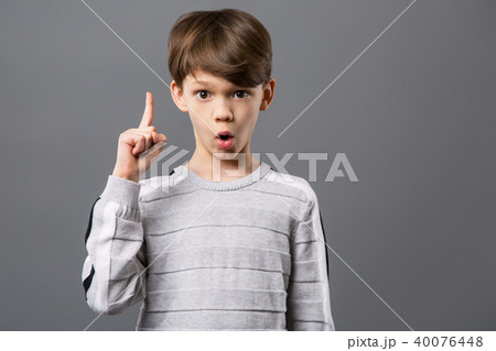 Delighted smart boy looking at you 40076448