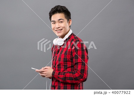 Joyful cheerful man smiling to you 40077922