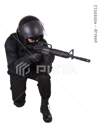 Riot police officer in black uniform Riot police officer in black uniform 40080012