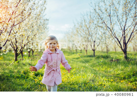 The little girl that runs in spring sunny day. Art processing an 40080961