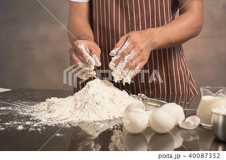 Chef hipster stylish hand mixing egg yolk Chef hipster stylish hand mixing egg yolk 40087352