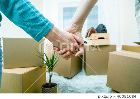 Photo of people holding hands in new apartment Photo of people holding hands in new apartment 40091084