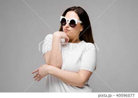 Attractive overweight woman in sunglasses Attractive overweight woman in sunglasses 40096877