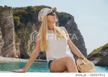 beautiful girl walking along the seashore in the summer day 40097652