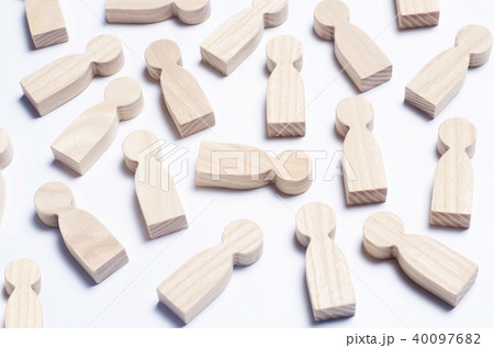 Wooden figures of people on a white background.  40097682