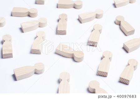 Wooden figures of people on a white background.  40097683