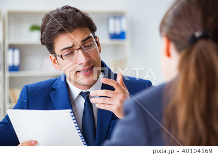 Lawyer talking to his client in office 40104169