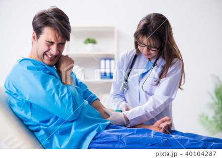 Scared patient man getting ready for flu shot Scared patient man getting ready for flu shot 40104287