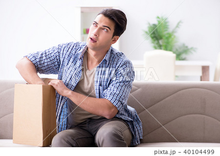 Man receiving parcel at home Man receiving parcel at home 40104499