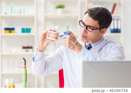 Young dentist working in the dentistry hospital Young dentist working in the dentistry hospital 40104758