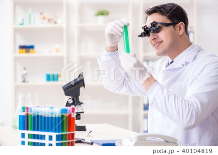 Chemist working on cannabis extract for medical purposes Chemist working on cannabis extract for medical purposes 40104819