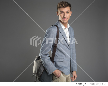 Happy undergrad standing with bag 40105349