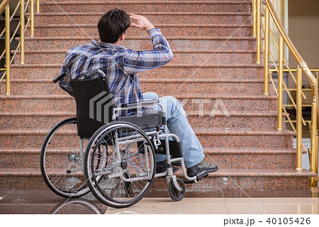 Disabled man on wheelchair having trouble with stairs 40105426