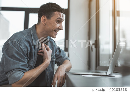 Happy male watching at gadget Happy male watching at gadget 40105818