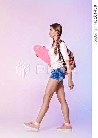 beautiful woman with skate in studio beautiful woman with skate in studio 40106429