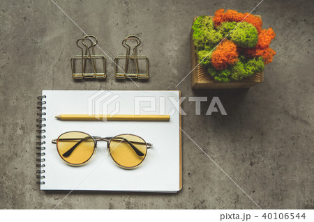 Spectacles and office incidentals with flower Spectacles and office incidentals with flower 40106544