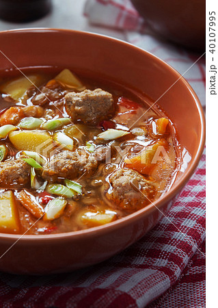 Lentil soup with meatballs macro shot 40107995