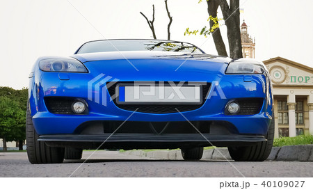 Front View of New Clean Blue Sport Car Parked on the Street Front View of New Clean Blue Sport Car Parked on the Street 40109027