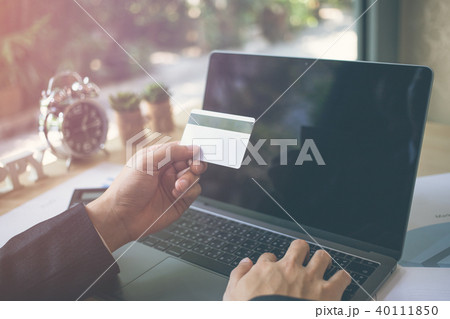 businessman hands holding credit card on computer 40111850