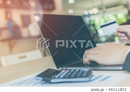 businessman hands holding credit card on computer 40111852