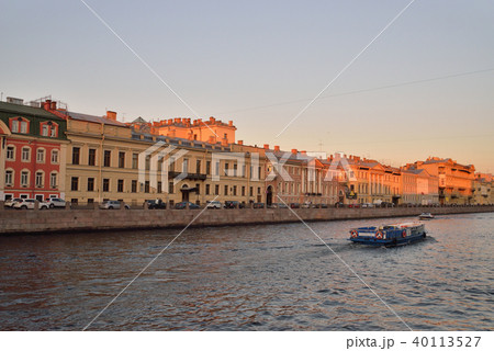 Pleasure boat on the Fontanka river at sunset Pleasure boat on the Fontanka river at sunset 40113527