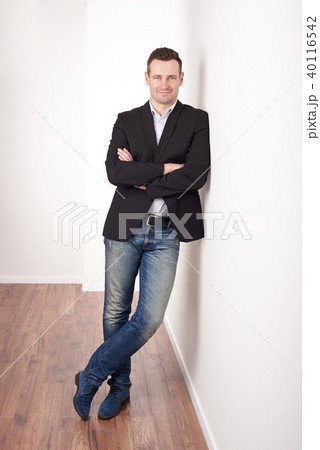 Smiling man with crossed arms Smiling man with crossed arms 40116542