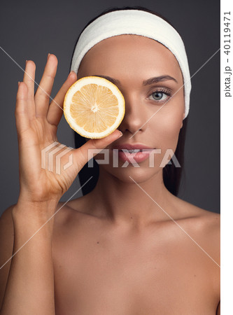 Appealing female person holding citrus Appealing female person holding citrus 40119471